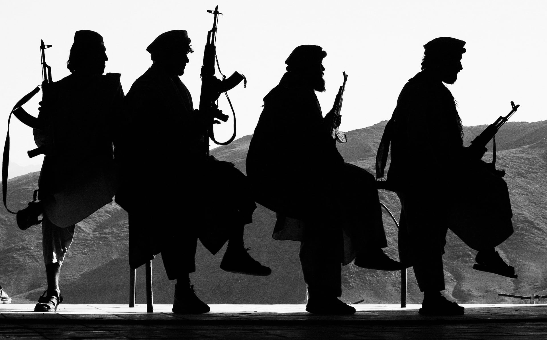Silhouettes of War in the Dust of Mountains